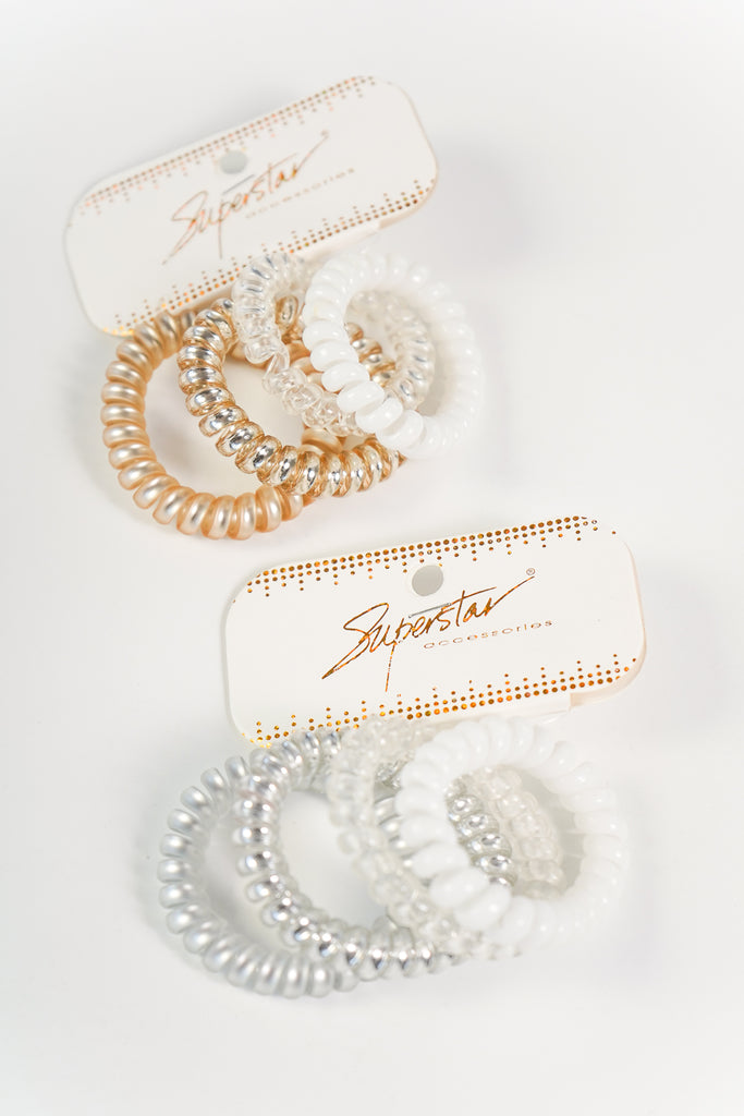 A set of spiral hair ties featuring an elasticized body and available in multiple colors.