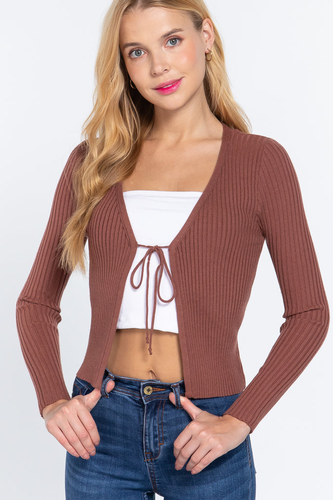 A long sleeve ribbed crop shirt featuring a deep v-neck and a front self-tie.