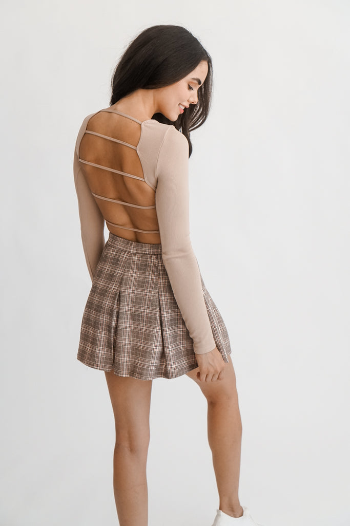 A mini pleated plaid skirt featuring an elasticized waist.