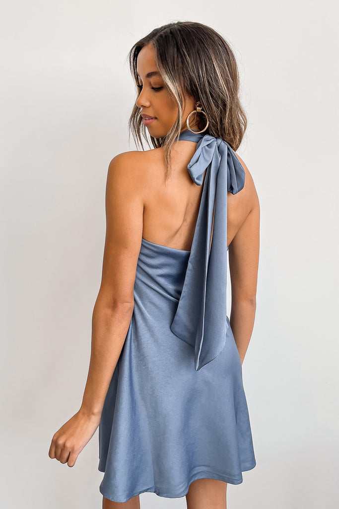 A blue satin halter dress featuring a self-tie neck, plunging neckline with an open back.