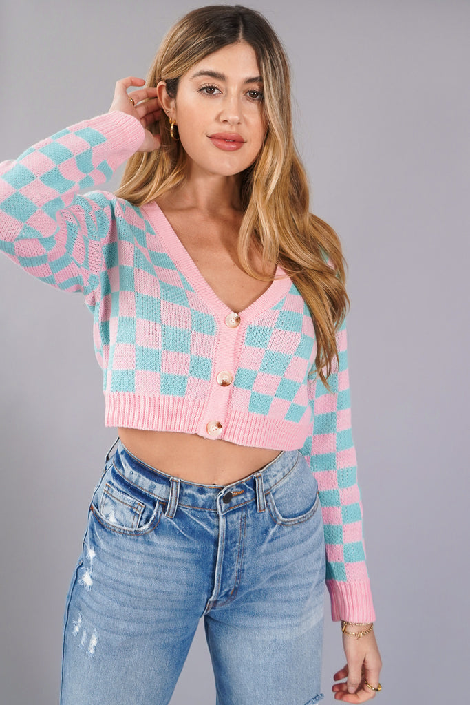 A ribbed knit cardigan sweater featuring allover checkered pattern, long sleeves, a semi-cropped hem, and button-front closures.