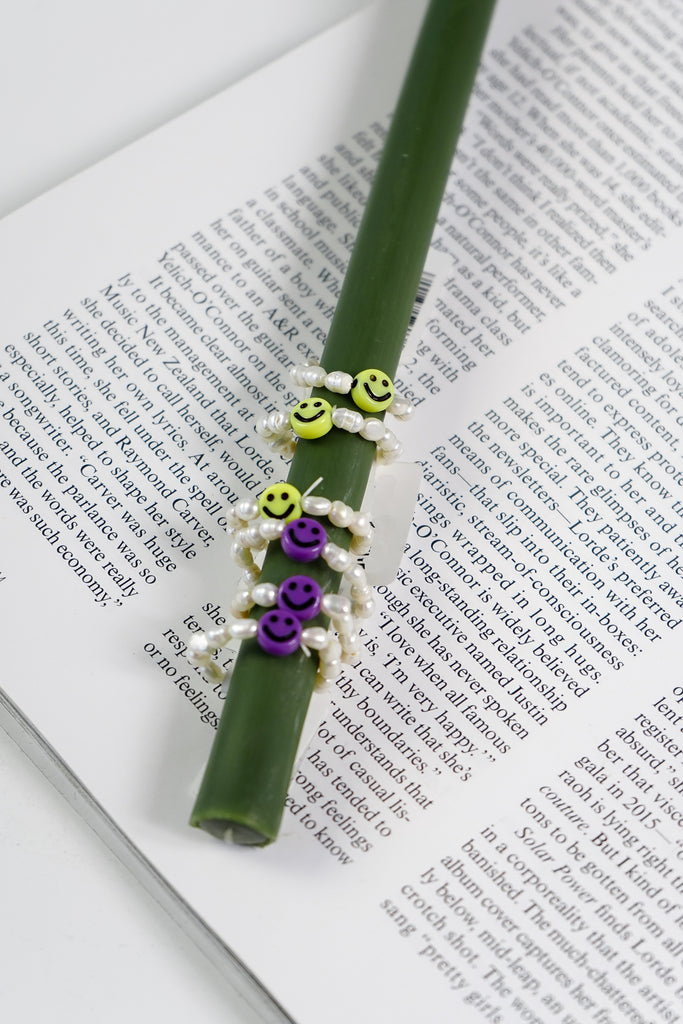 A little smile goes a long way with this oh-so-cute little pearl beaded ring. people