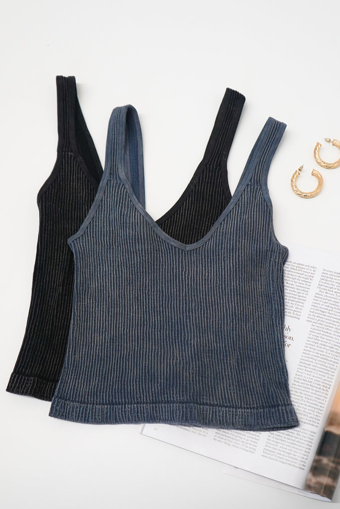 A ribbed knit tank top featuring an allover mineral wash and a V-cut neckline and back.
