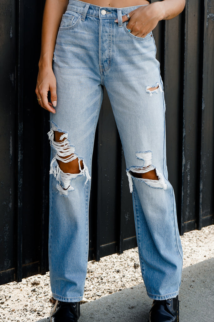 A pair of denim jeans featuring a five-button construction, pockets, belt loops and straight legs.