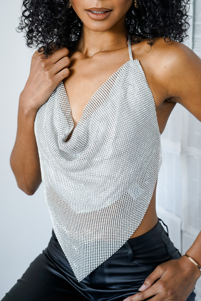 A rhinestone bandana halter top featuring a cowl neck, and self-tie open back.